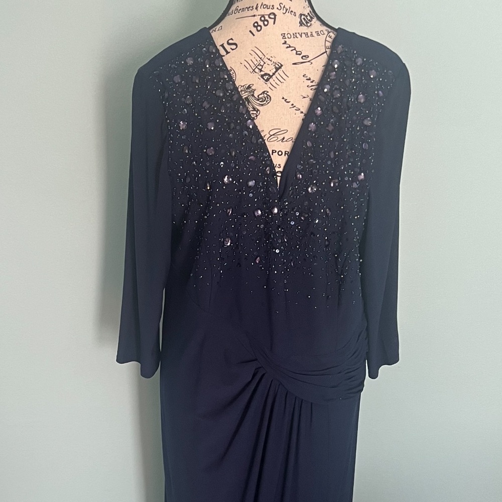 Midnight blue with sequin bodice.  3/4 length sleeves. Worn once. Size 14W.